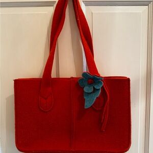 Orange felt purse with teal bow